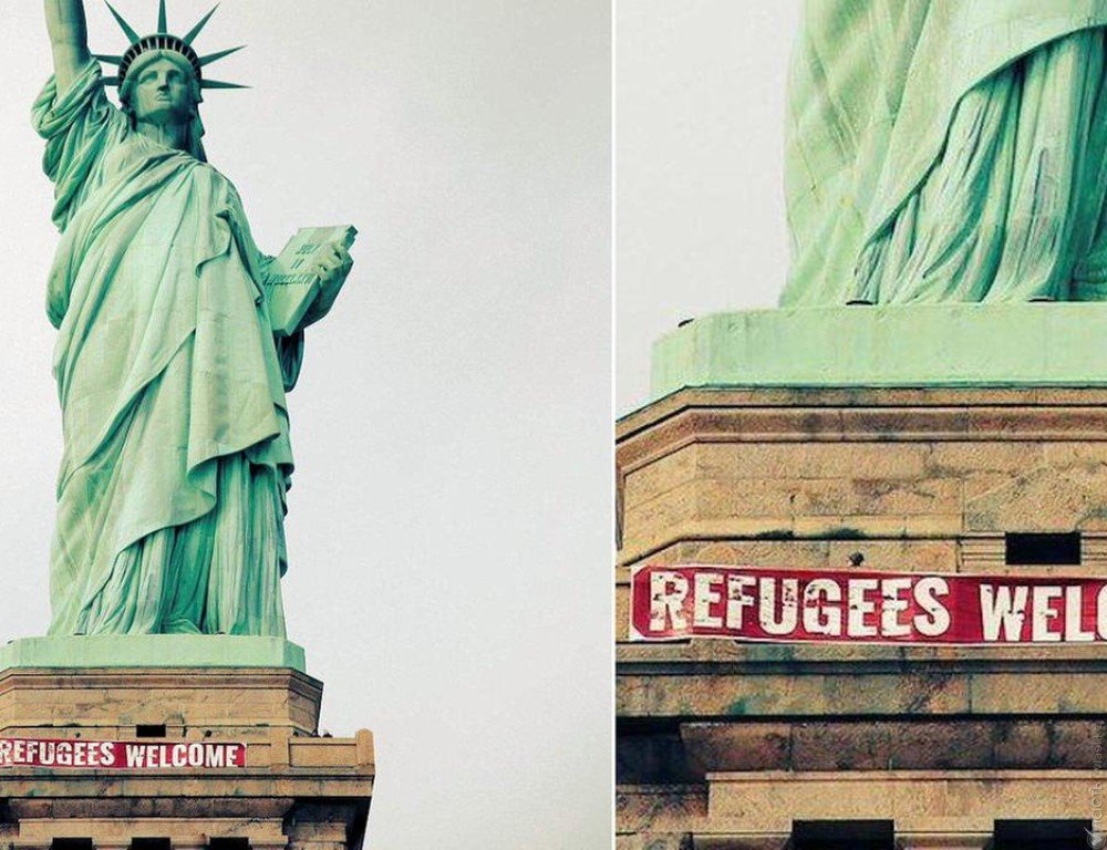 На статуе cвободы в Нью-Йорке вывесили баннер с приветствием для беженцев