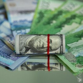 Доллар торгуется на бирже по 519,11 тенге