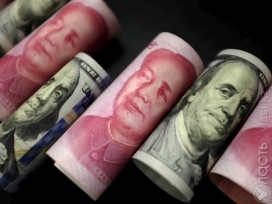 Народный банк Китая вновь понизил курс юаня 